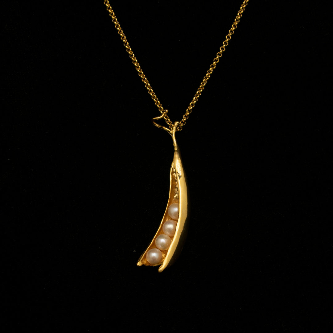 Image of the Michael Michaud Fine Pea Pod 4 Pearls Pendant on a black background