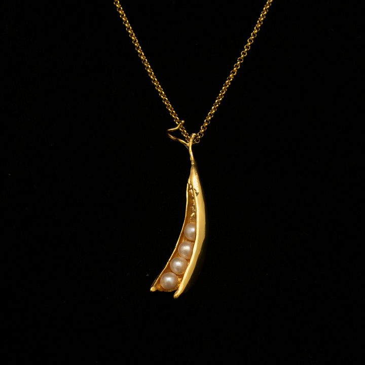 Image of the Michael Michaud Fine Pea Pod 4 Pearls Pendant on a black background