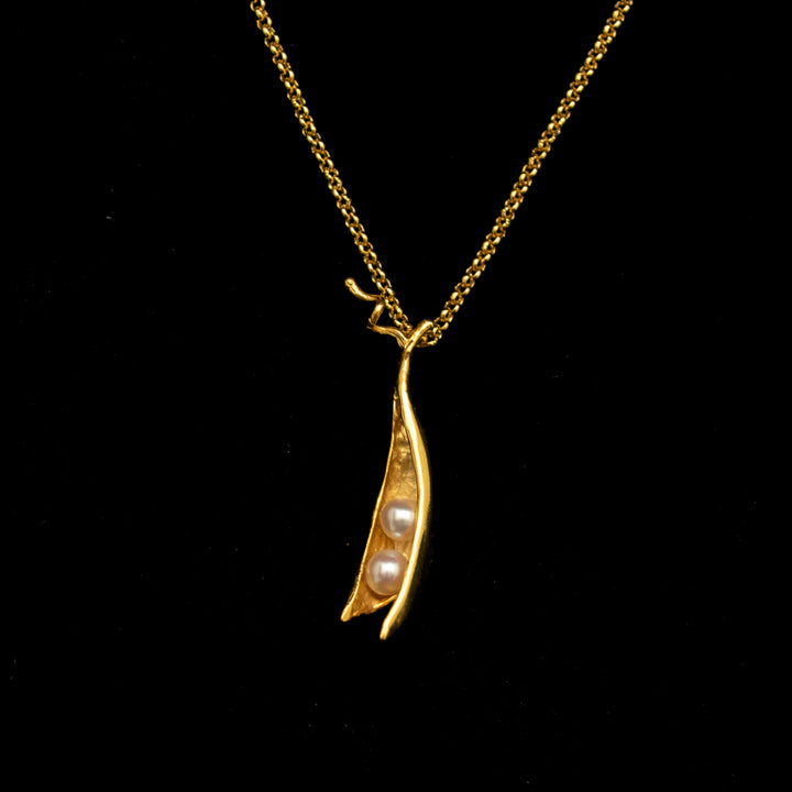 Image of the Michael Michaud Fine Pea Pod 2 Pearls Pendant on a black background