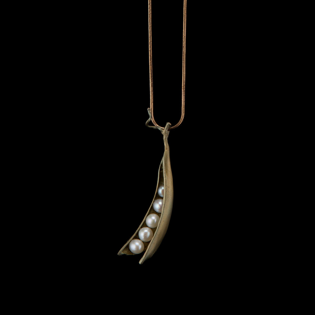 Image of the Michael Michaud Pea Pod Pendant - 5 Pearls on a black background