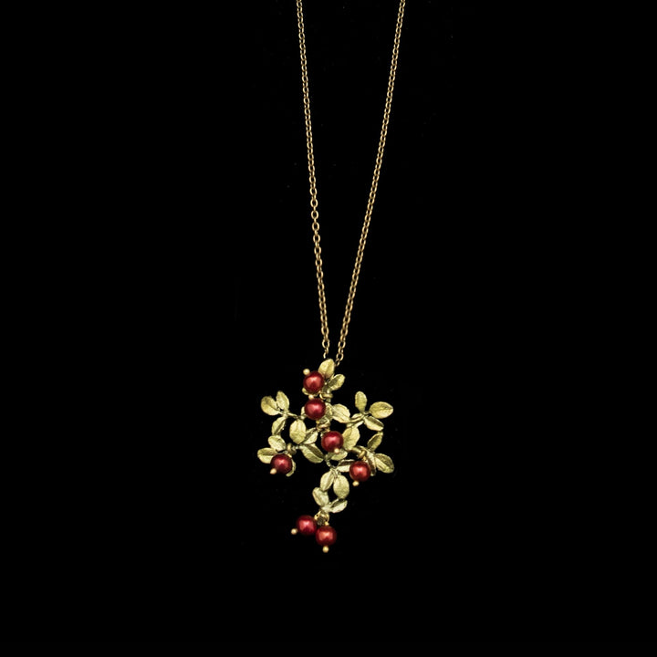 Image of the Michael Michaud Cranberry Pendant on a black background