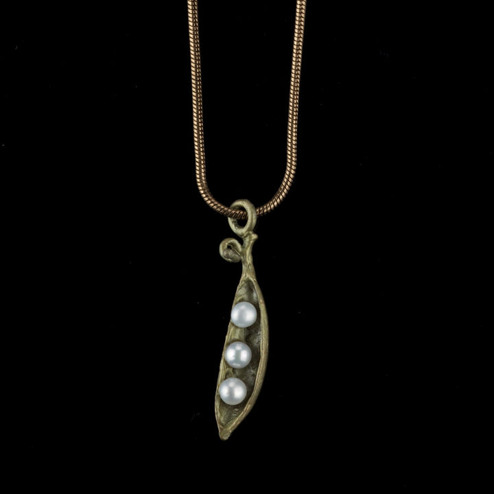 Image of the Michael Michaud Pea Pod Petite Pendant - 3 Pearls on a black background