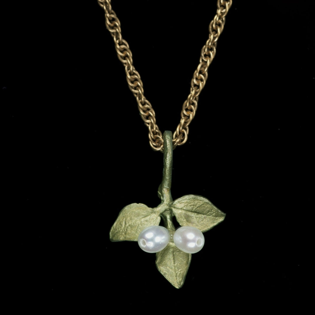 Image of the Michael Michaud Myrtle Petite Pendant on a black background
