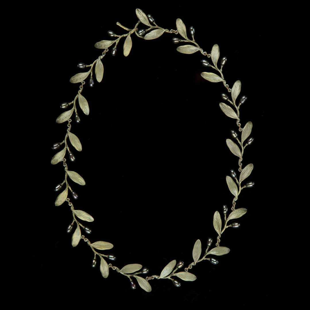 Image of the Michael Michaud Olive Necklace on a black background
