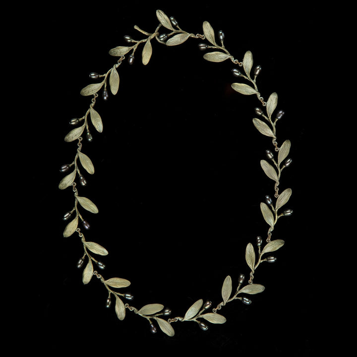 Image of the Michael Michaud Olive Necklace on a black background