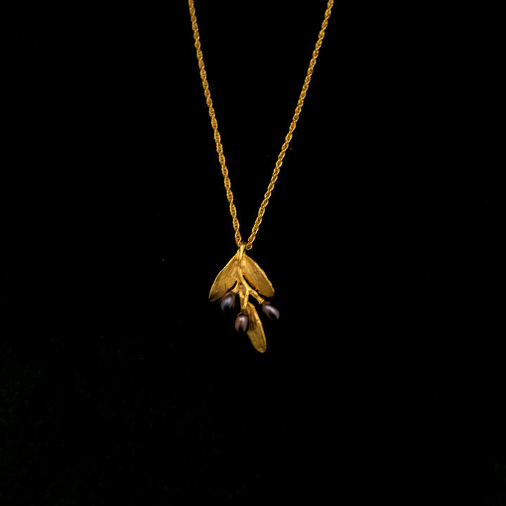Image of the Michael Michaud Fine Olive Gold Pendant on a black background