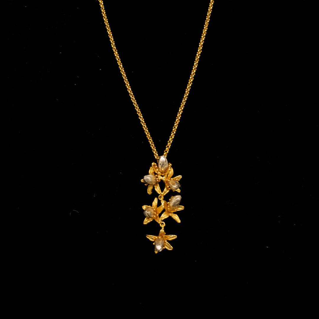Image of the Michael Michaud Fine Orange Blossom Pendant on a black background