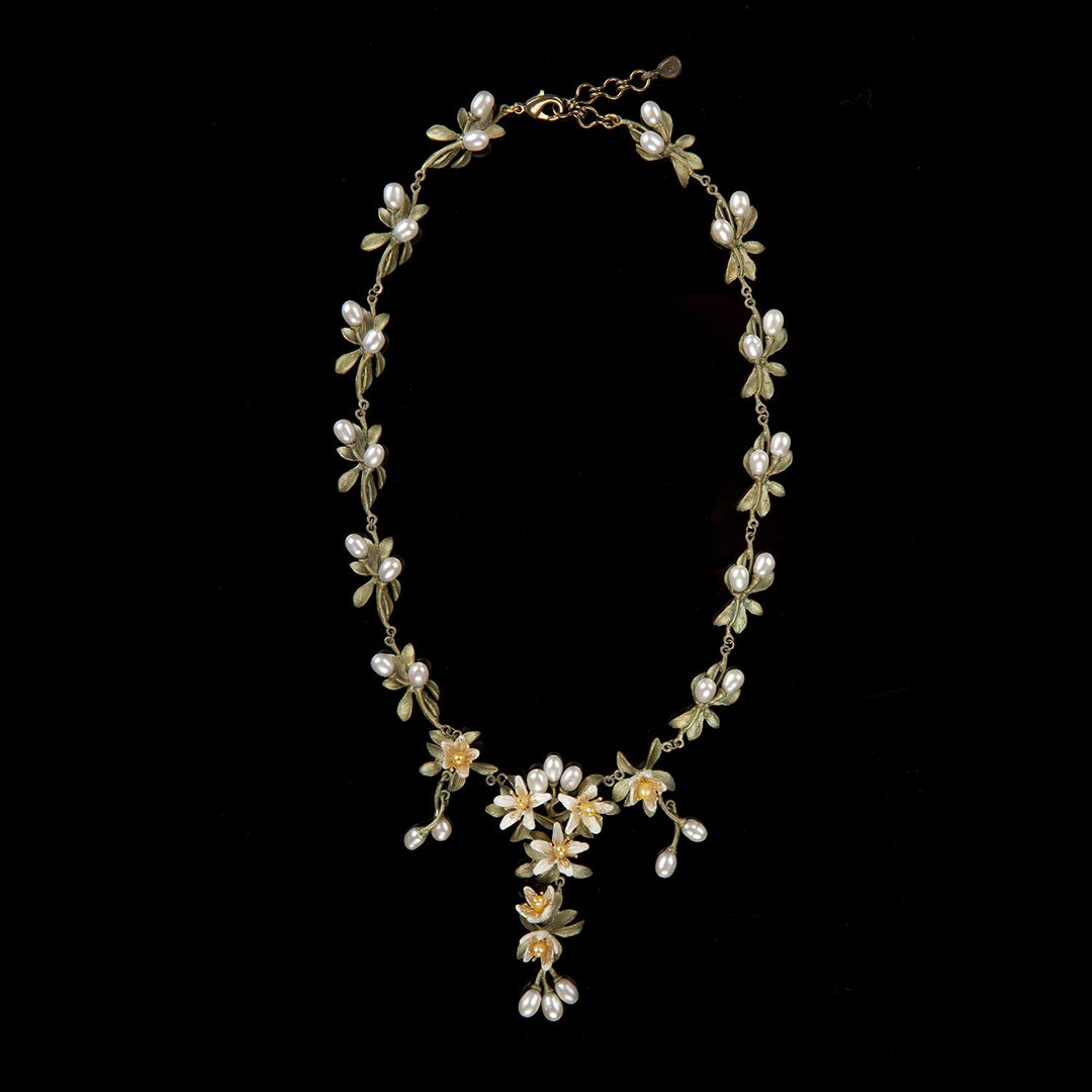 Image of the Michael Michaud Orange Blossom Statement Necklace - Flowers on a black background