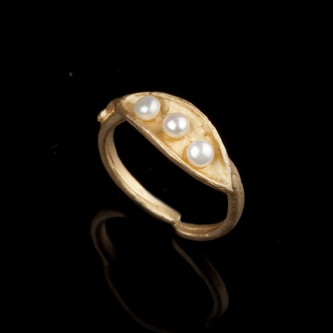 Image of the Michael Michaud Pea Pod Triple Pearl - Ring on a black background