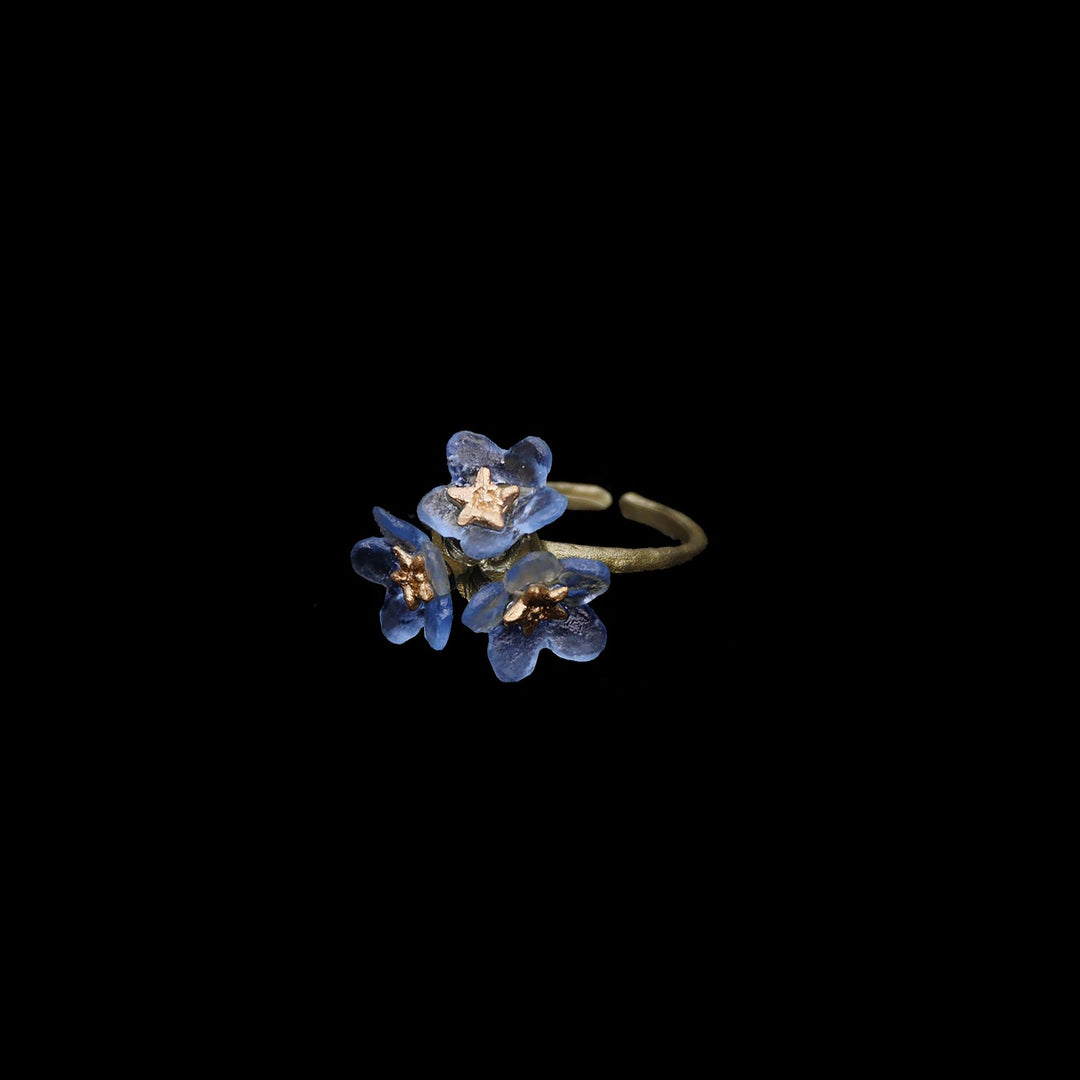Image of the Michael Michaud Forget Me Not Ring - Triple on a black background