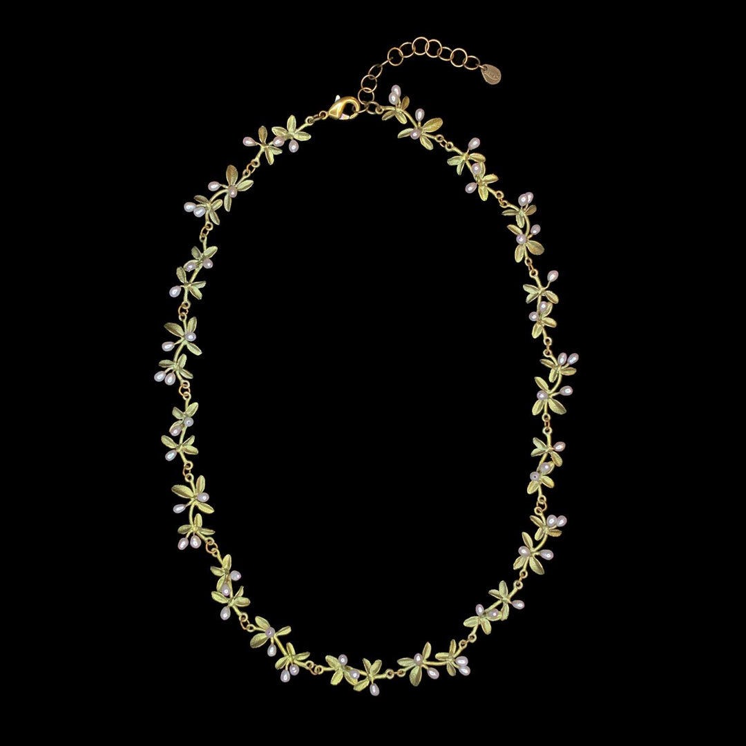 Image of the Michael Michaud Flowering Thyme Necklace on a black background