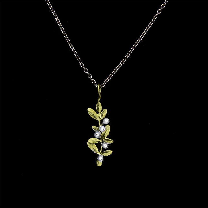 Image of the Michael Michaud Flowering Thyme Pendant on a black background