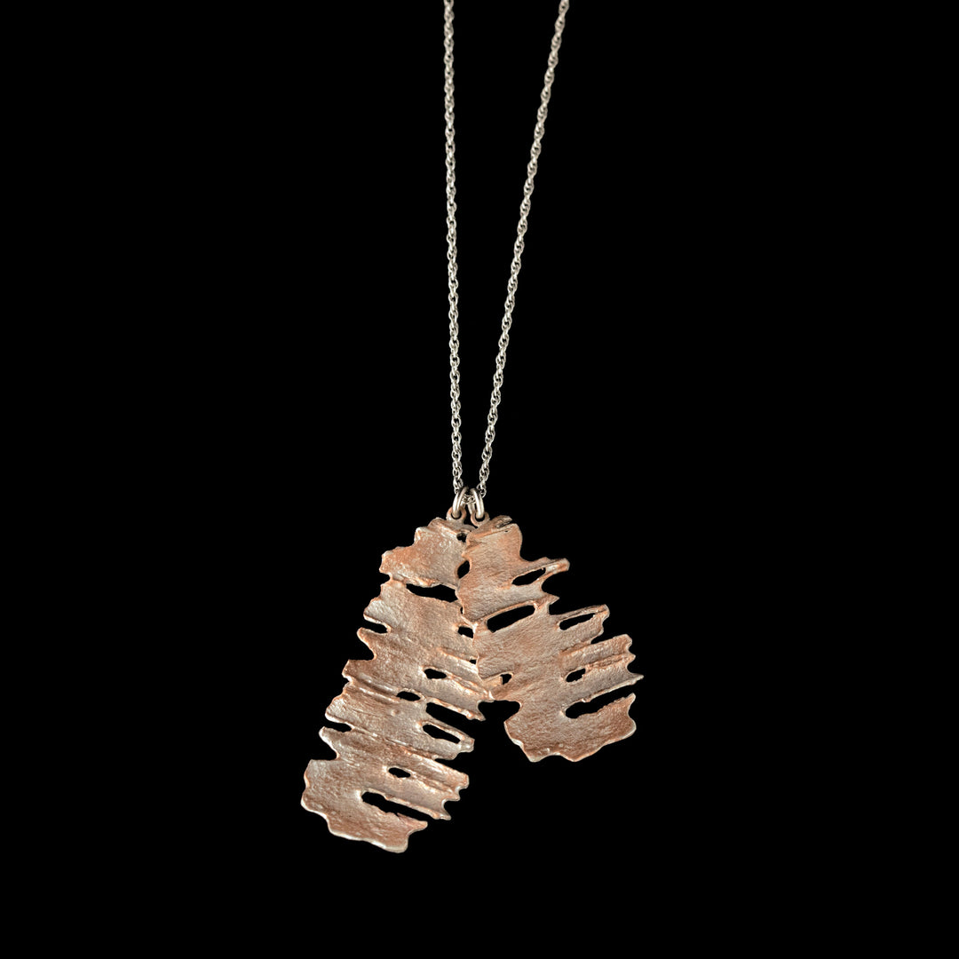 Image of the Michael Michaud Fine Birch Silver Tag Pendant on a black background