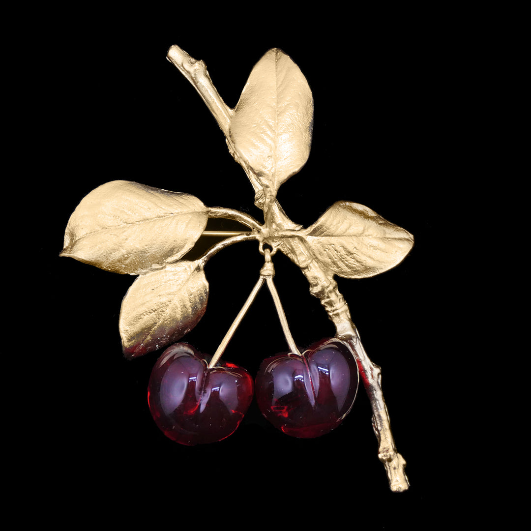 Image of the Michael Michaud Fine Morello Cherry Brooch on a black background