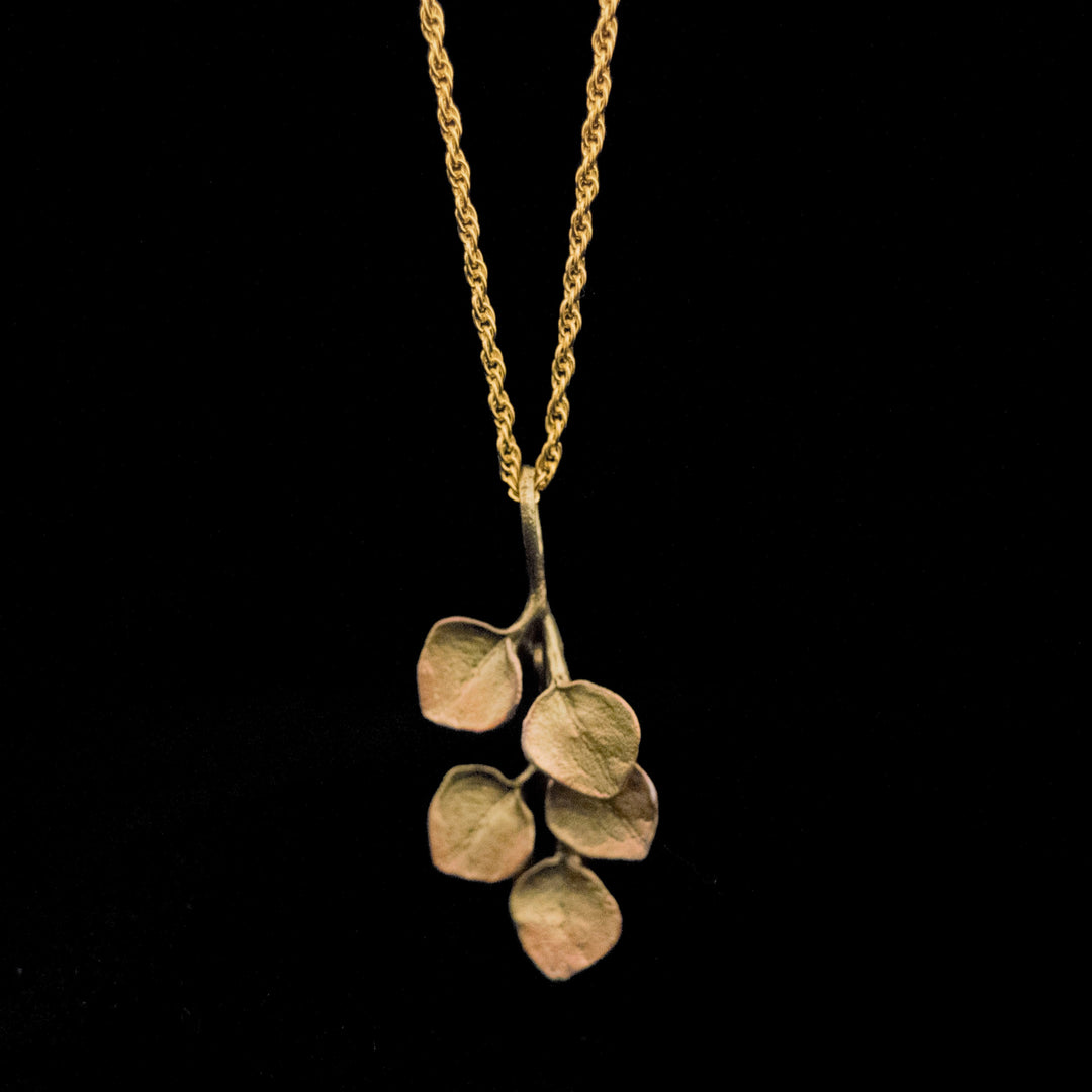 Image of the Michael Michaud Fine Survivor Tree Leaf Pendant on a black background