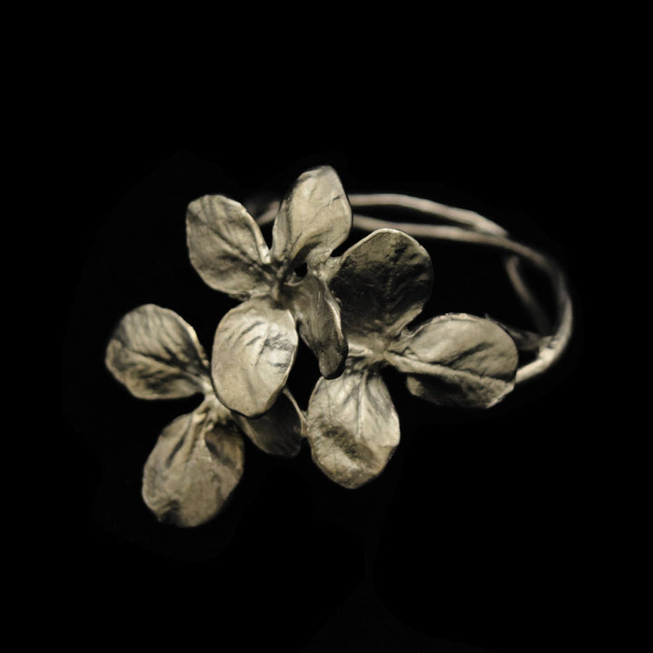 Image of the Michael Michaud Clover Napkin Rings - Pewter on a black background