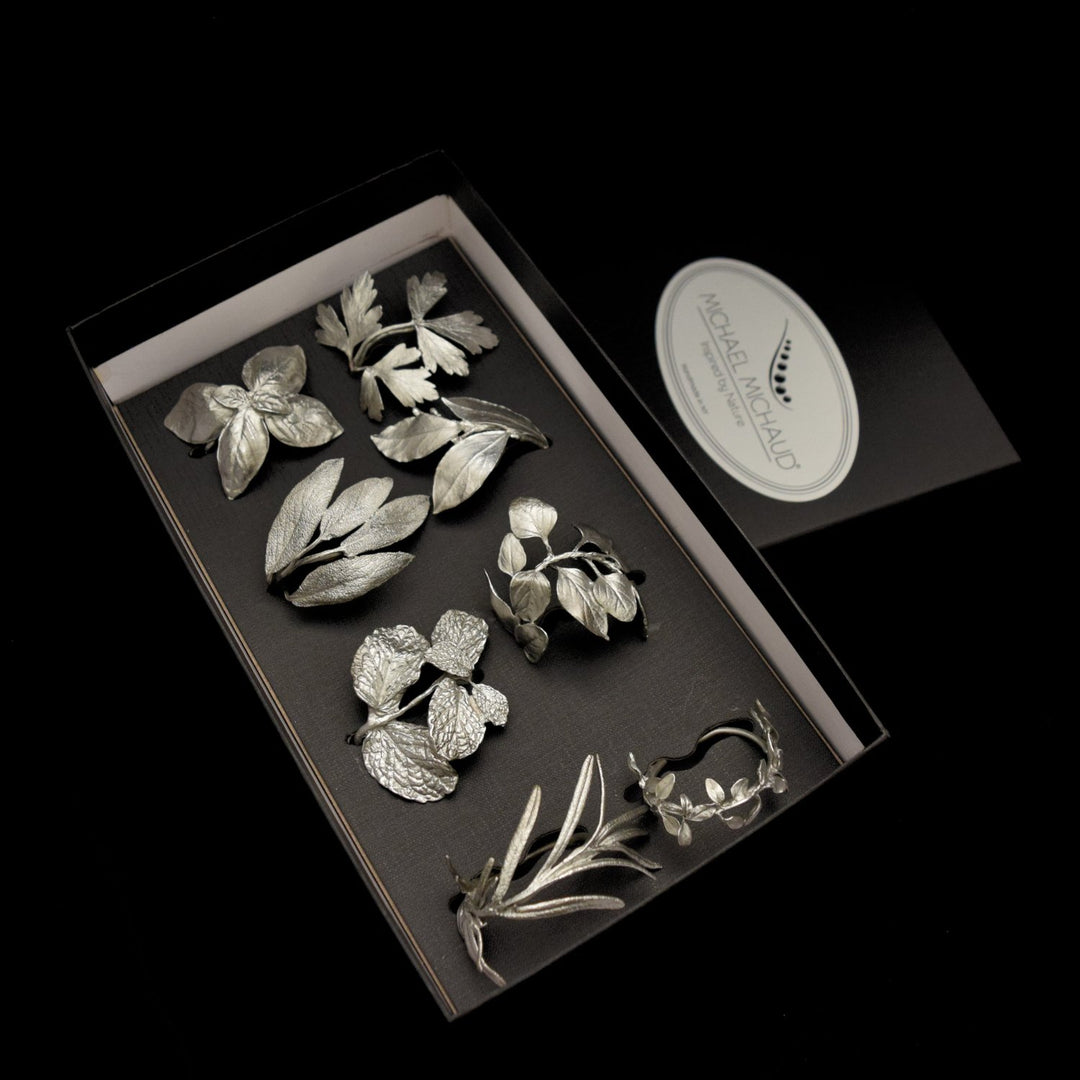 Image of the Michael Michaud Herb Assortment for Eight Napkin Rings - Pewter on a black background