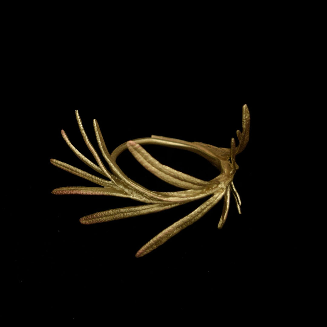 Image of the Michael Michaud Rosemary Napkin Rings on a black background