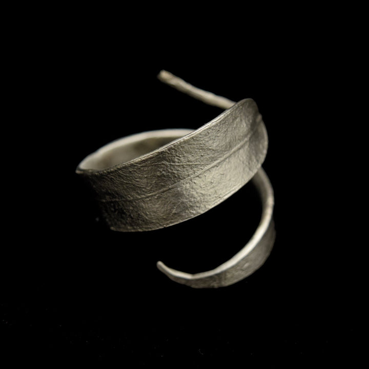 Image of the Michael Michaud Eucalyptus Napkin Rings -Pewter on a black background