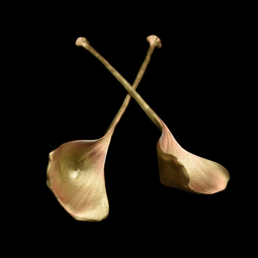 A pair of Ginkgo leaf-shaped serving spoons with a bronze finish.