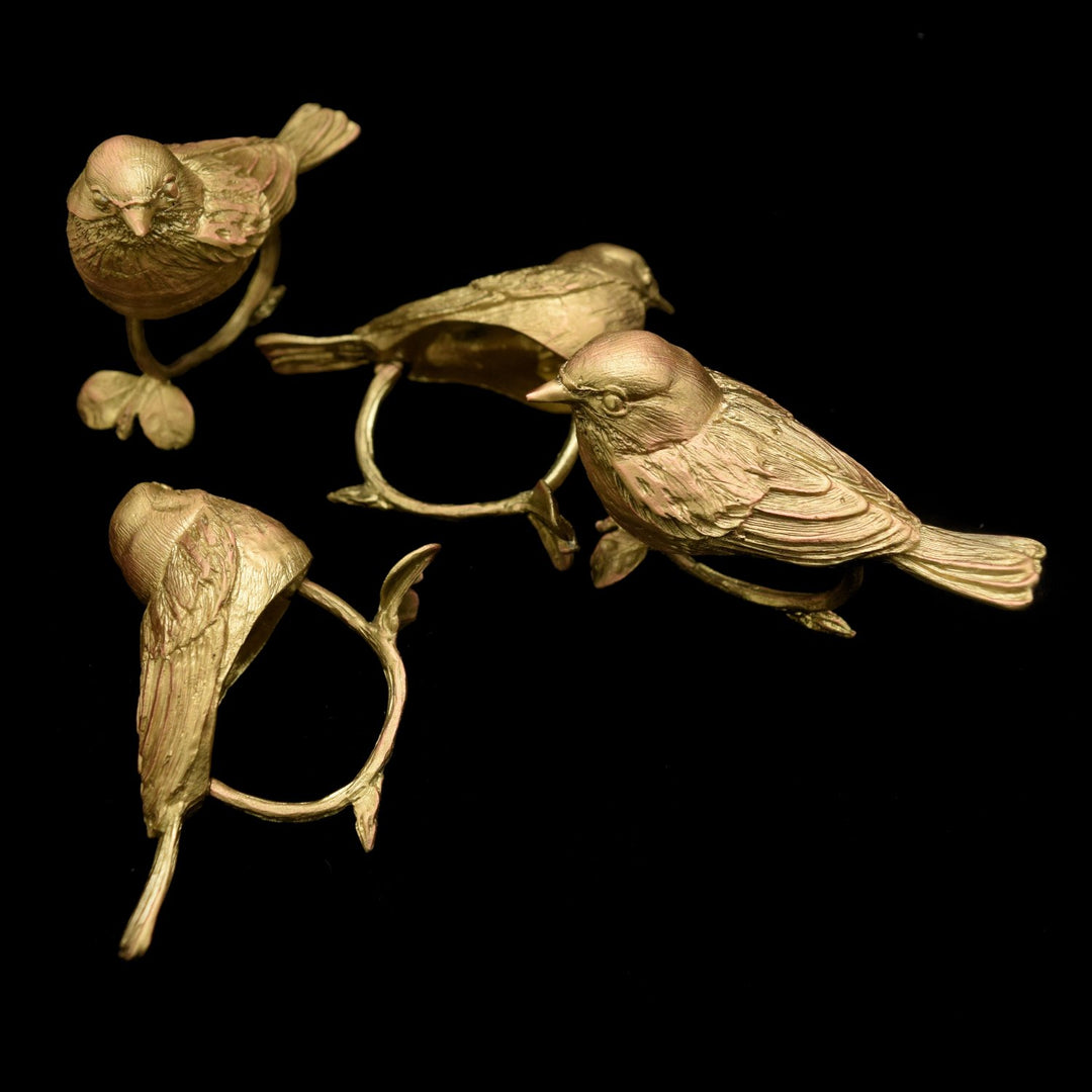 Image of the Michael Michaud Warbler Napkin Rings - Bronze on a black background