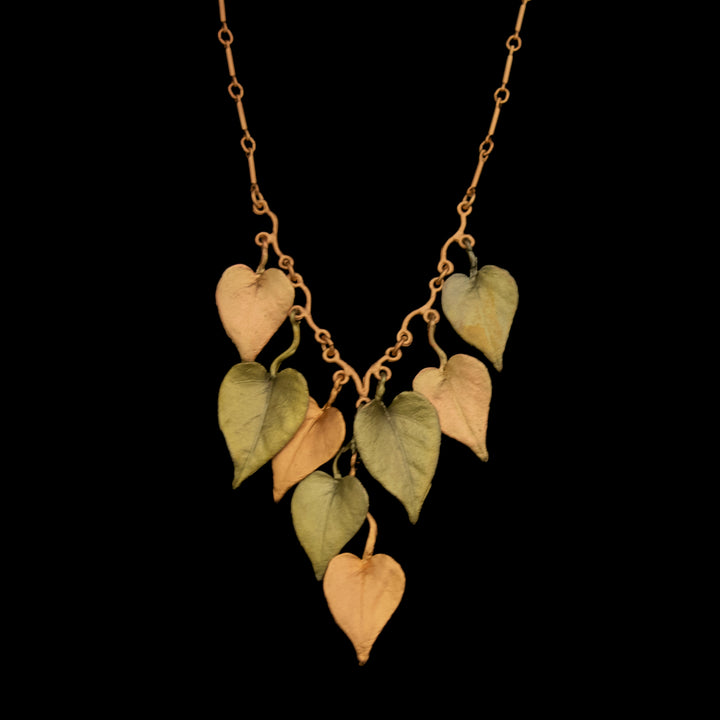 Image of the Michael Michaud Sweet Potato Vine Necklace on a black background