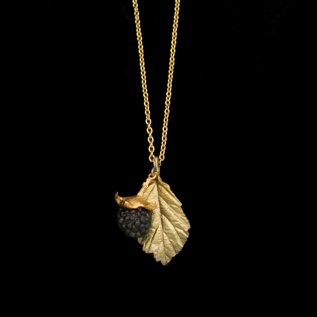 Image of the Michael Michaud Blackberry Pendant - Leaf on a black background