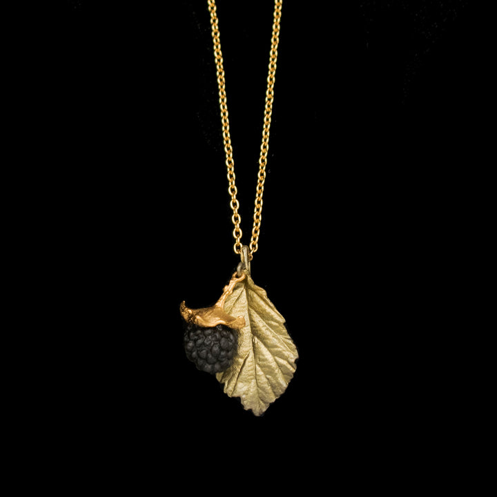 Image of the Michael Michaud Blackberry Pendant - Leaf on a black background