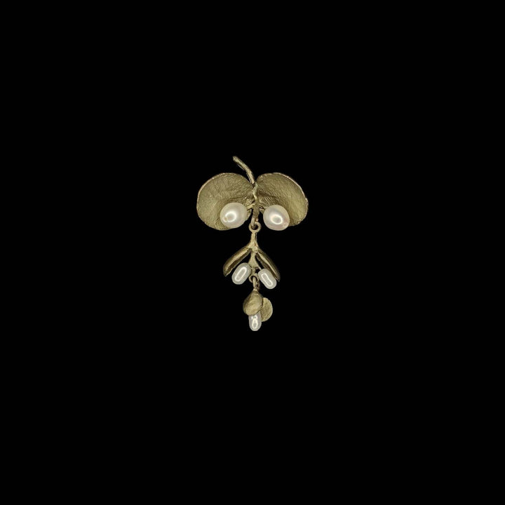 Image of the Michael Michaud Eucalyptus Seed Lapel Pin on a black background