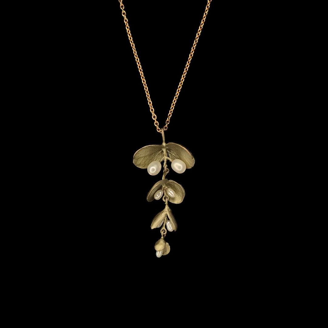 Image of the Michael Michaud Eucalyptus Seed Pendant on a black background