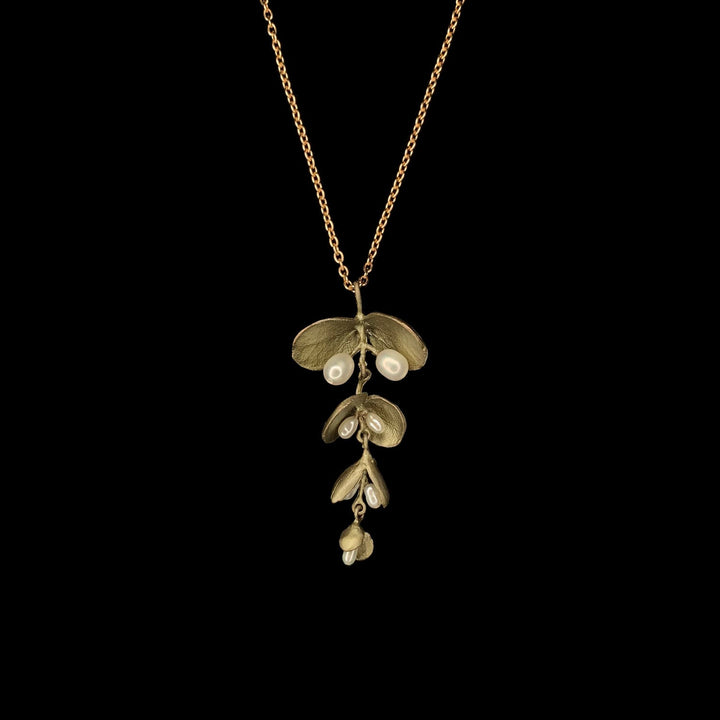Image of the Michael Michaud Eucalyptus Seed Pendant on a black background