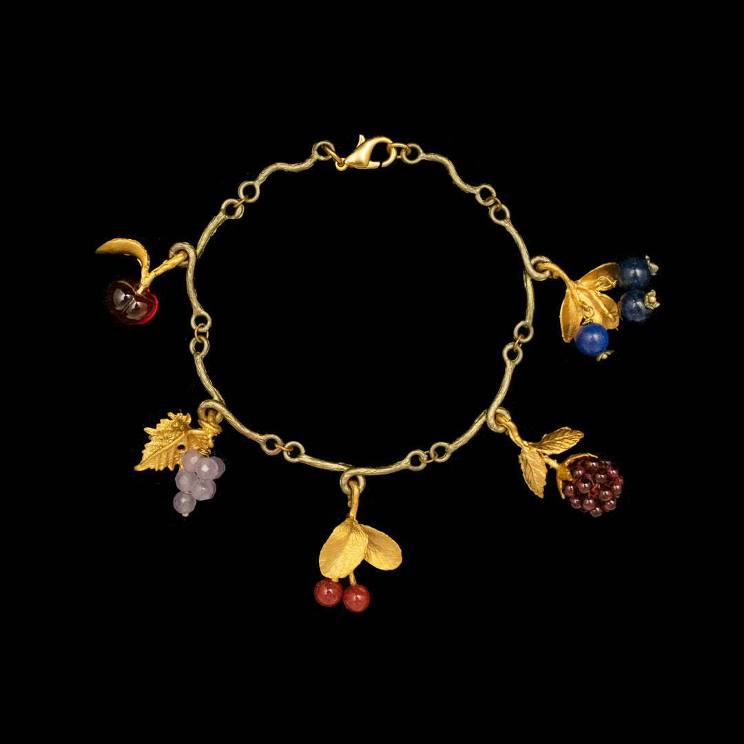 Image of the Michael Michaud Limited Edition Fruit Charm Bracelet on a black background