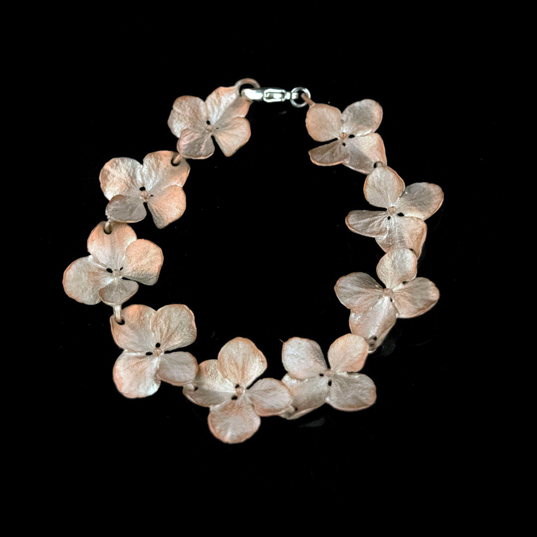 Image of the Michael Michaud Fine Hydrangea Silver Flower Bracelet on a black background