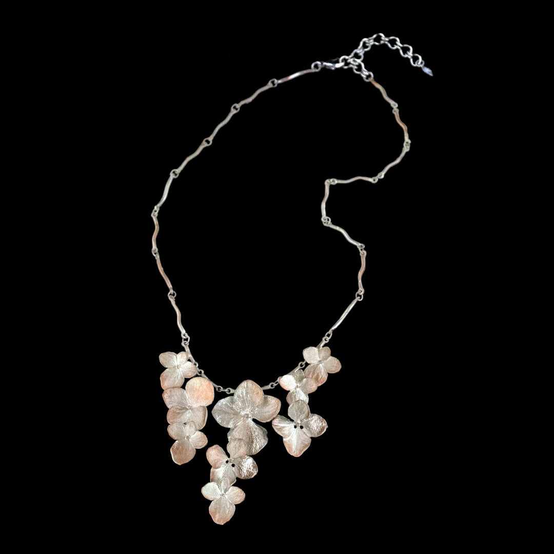 Image of the Michael Michaud Fine Hydrangea Silver Flower Necklace on a black background