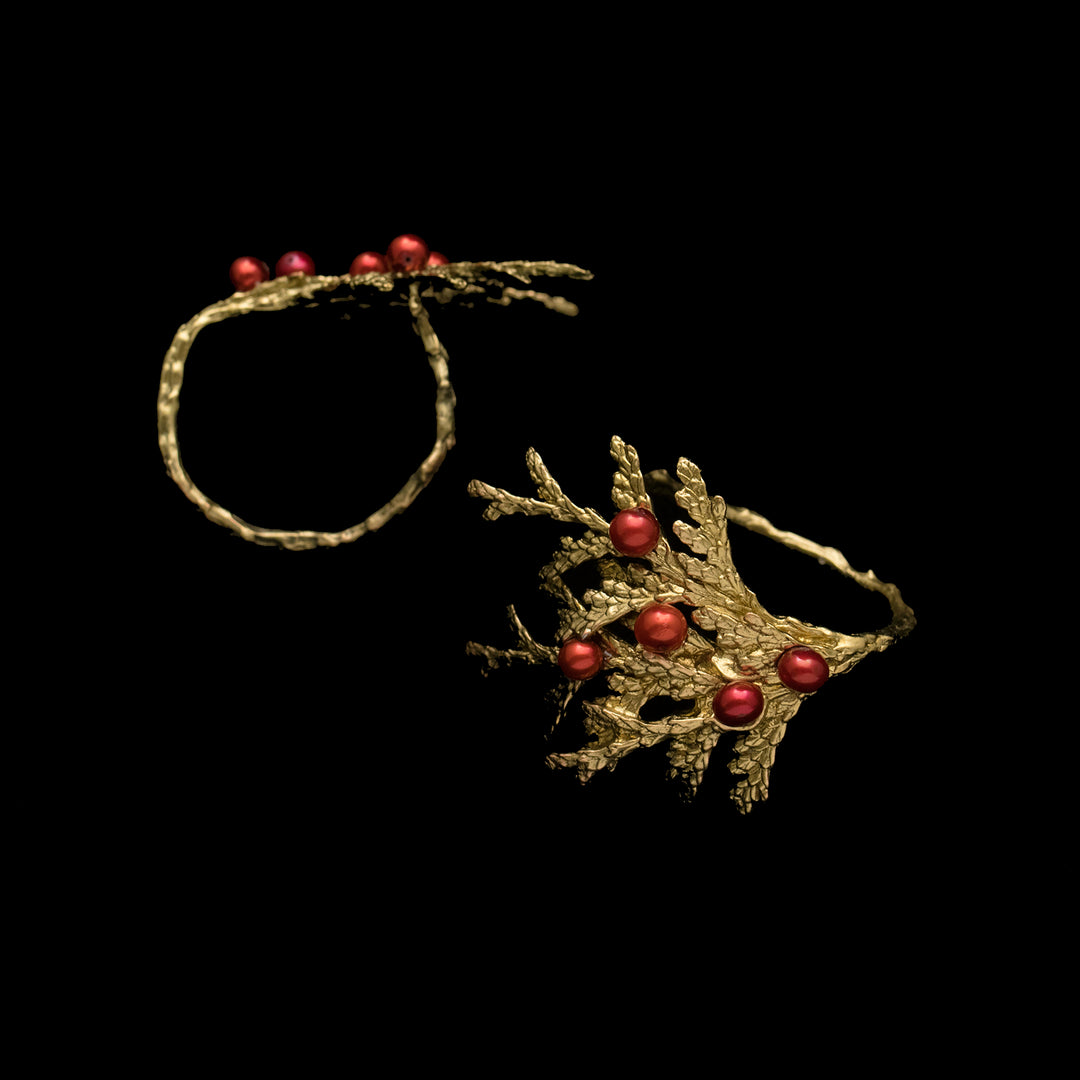 Image of the Michael Michaud Holiday Arbor Napkin Rings Set of 4 on a black background