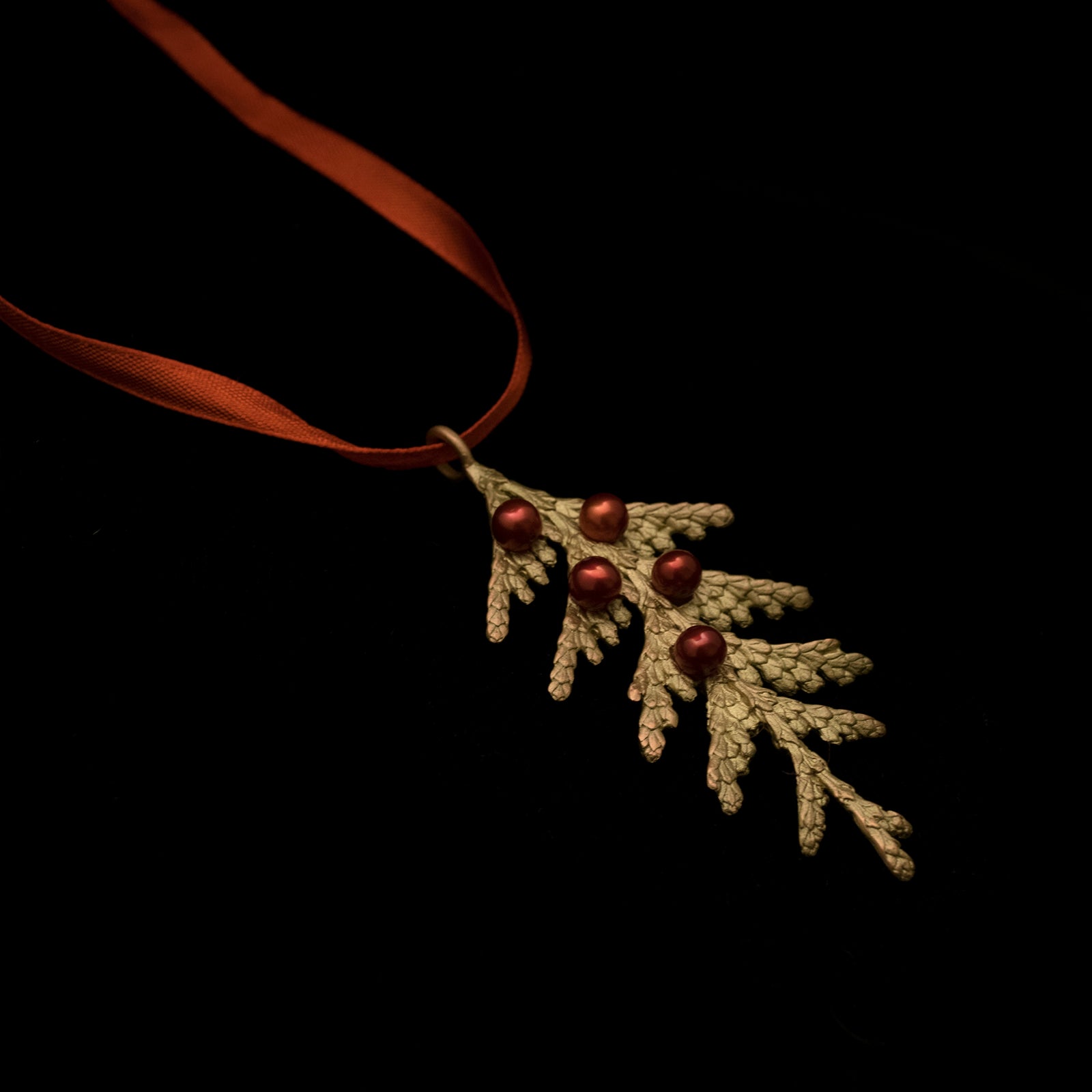 Image of the Michael Michaud Holiday Arbor Ornament on a black background