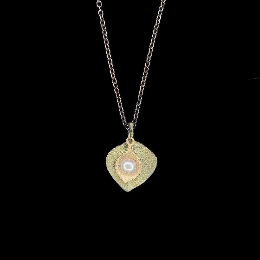 Image of the Michael Michaud Round Leaf Eucalyptus Pendant - Dainty on a black background