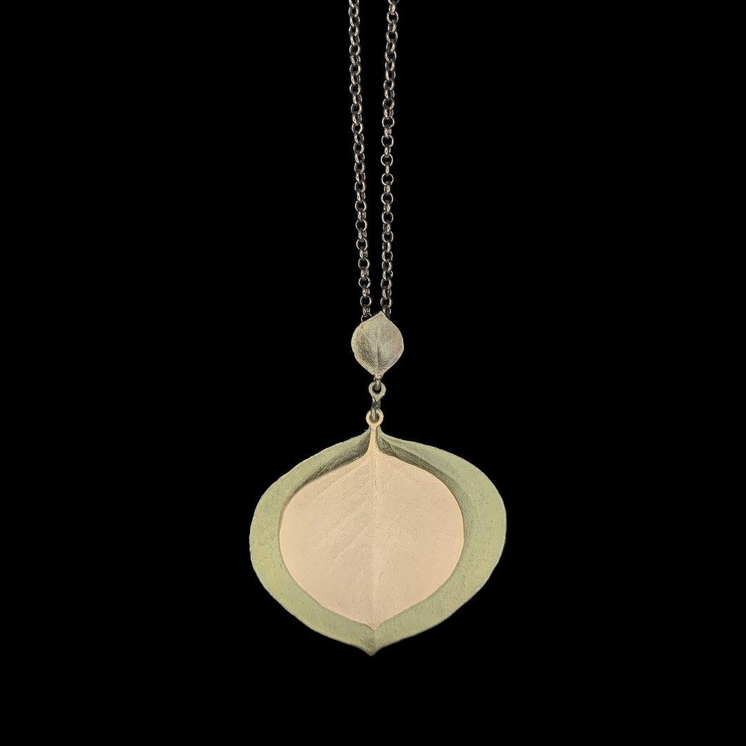 Image of the Michael Michaud Round Leaf Eucalyptus Pendant - Large Double Leaves on a black background