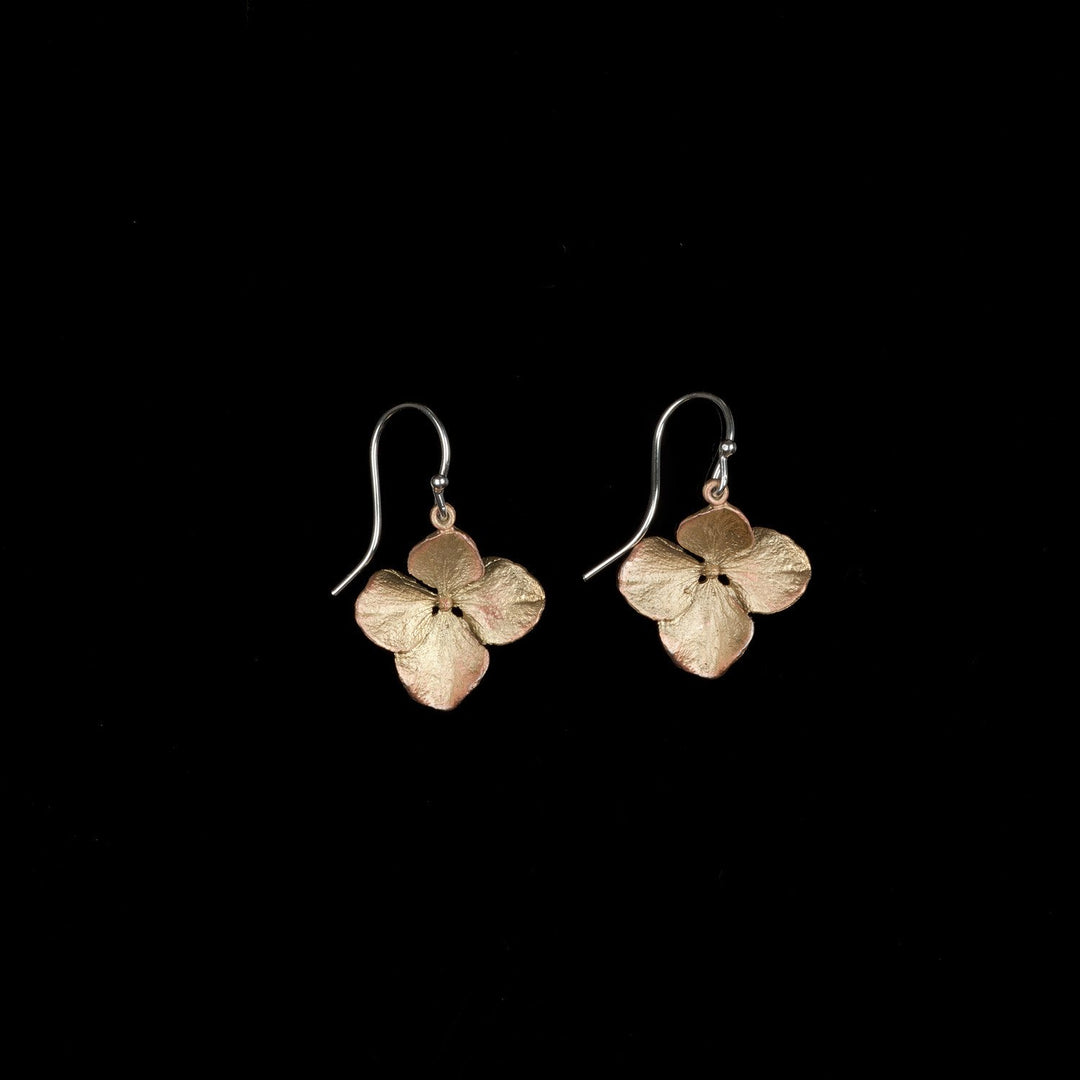 A pair of bronze Hydrangea flower earrings with gold plated silver wires on a black background.