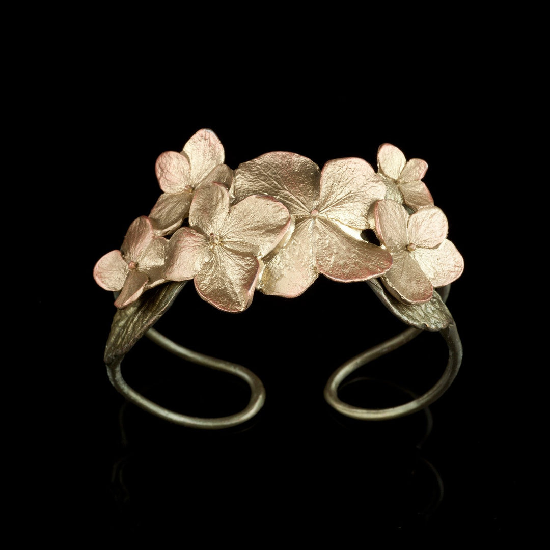 Image of the Michael Michaud Hydrangea Cuff Bracelet on a black background
