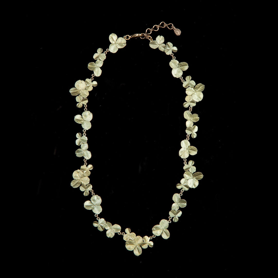 Image of the Michael Michaud Clover Necklace on a black background