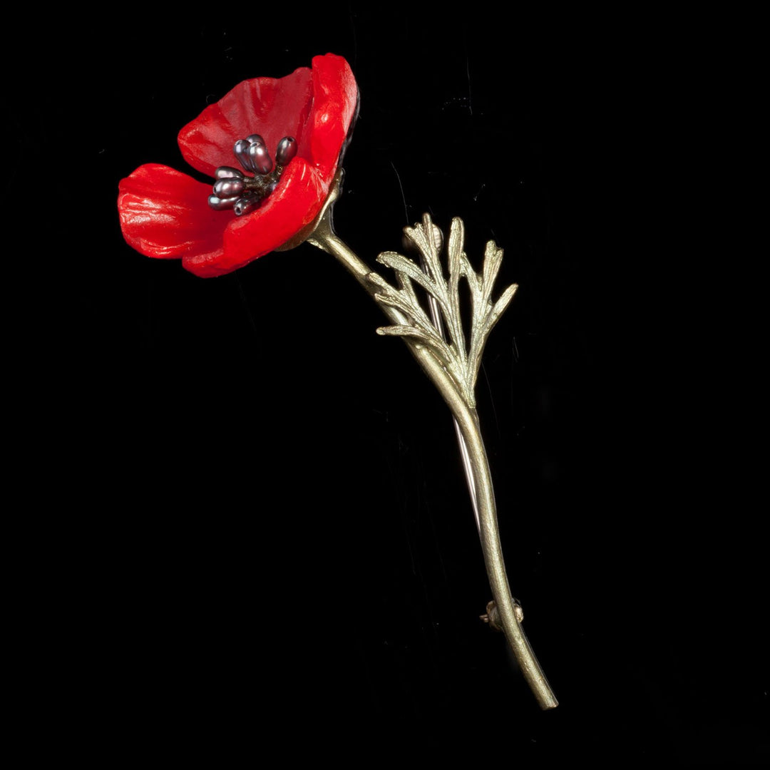Image of the Michael Michaud Red Poppy Brooch on a black background
