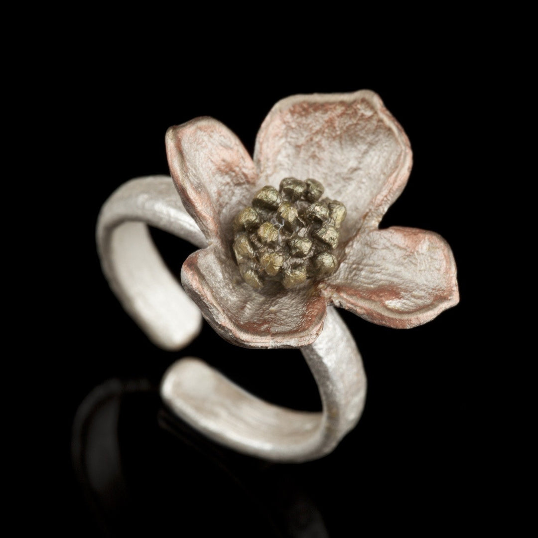 Image of the Michael Michaud Dogwood Flower Ring on a black background