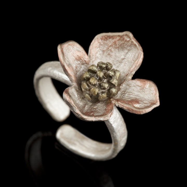 Image of the Michael Michaud Dogwood Flower Ring on a black background