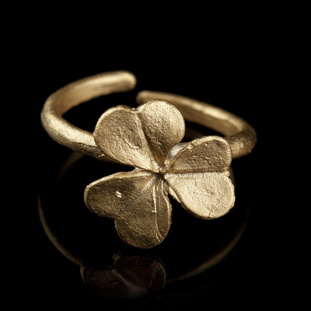 Image of the Michael Michaud Clover Ring on a black background