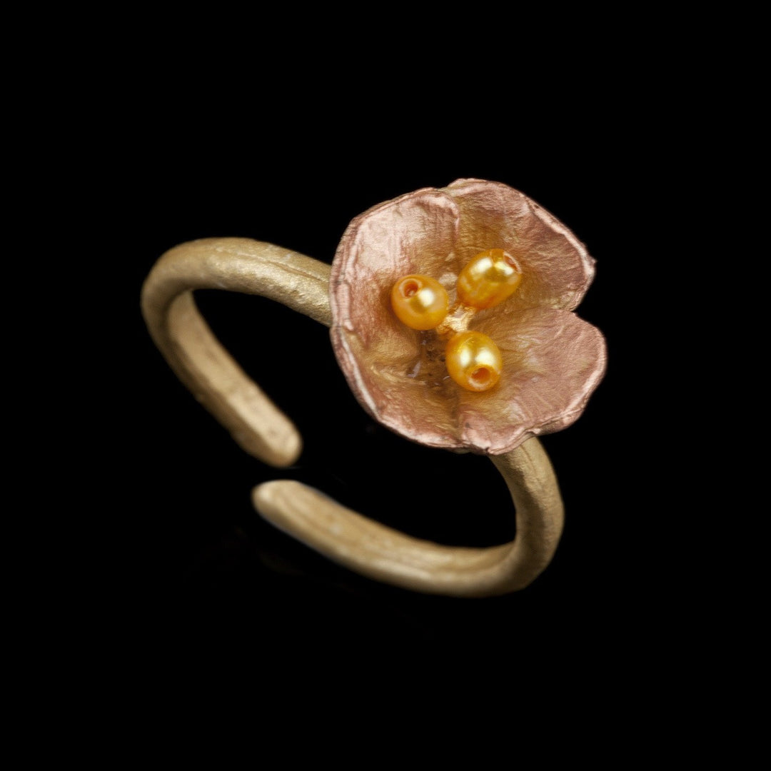 Image of the Michael Michaud California Poppy Ring on a black background