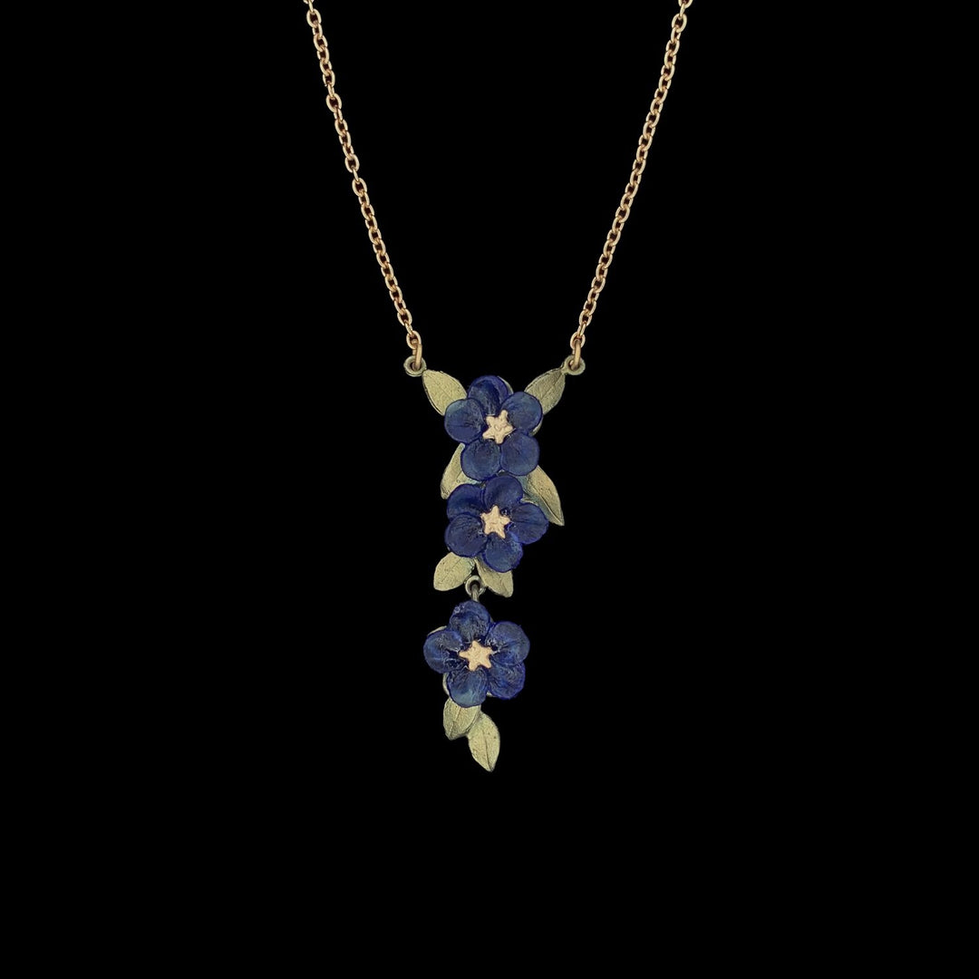Image of the Michael Michaud Blue Violet Pendant - Triple Flower on a black background