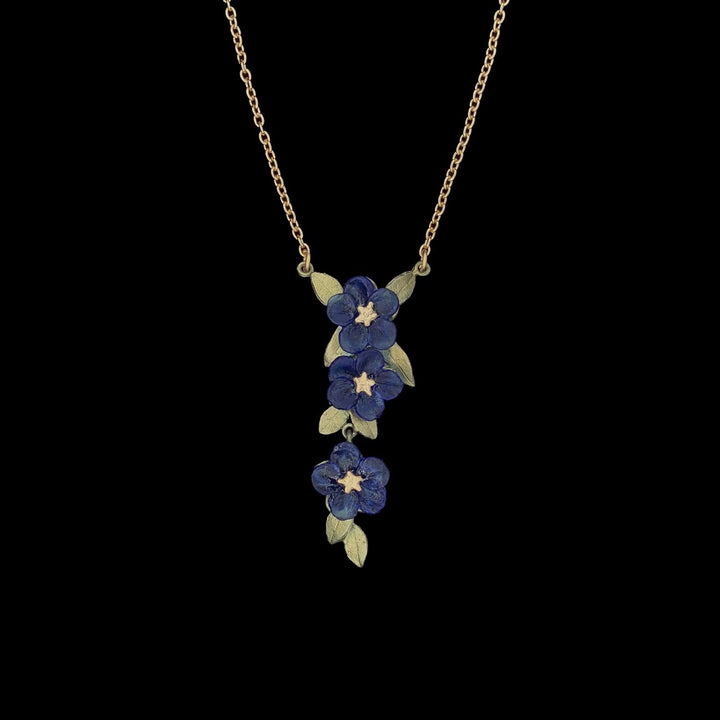 Image of the Michael Michaud Blue Violet Pendant - Triple Flower on a black background
