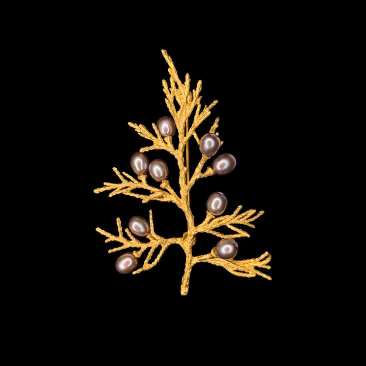 Image of the Michael Michaud Juniper Brooch on a black background