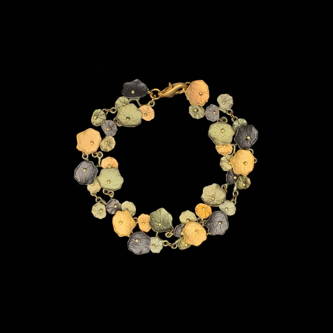 Image of the Michael Michaud Nasturtium Bracelet on a black background